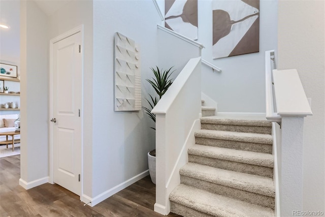 staircase featuring hardwood / wood-style floors