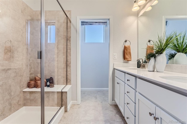 bathroom featuring vanity and a shower with shower door