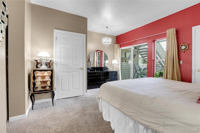 bedroom featuring a notable chandelier, carpet, and access to exterior