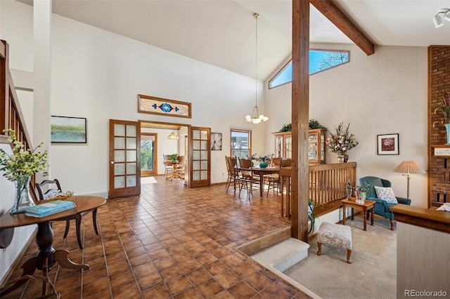5245 Sapphire Dr, Colorado Springs, CO 80918 - entryway with high vaulted ceiling, french doors, healthy amount of natural light, beam ceiling, and a chandelier