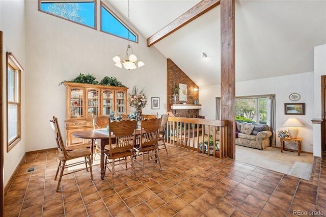 5245 Sapphire Dr, Colorado Springs, CO 80918 - dining room featuring high vaulted ceiling, a chandelier, and beam ceiling