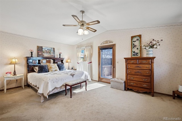 5245 Sapphire Dr, Colorado Springs, CO 80918 - bedroom featuring access to exterior, vaulted ceiling, carpet floors, wallpapered walls, and ceiling fan