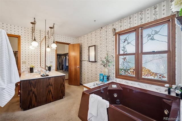 5245 Sapphire Dr, Colorado Springs, CO 80918 - full bathroom with wallpapered walls, a tub with jets, and vanity