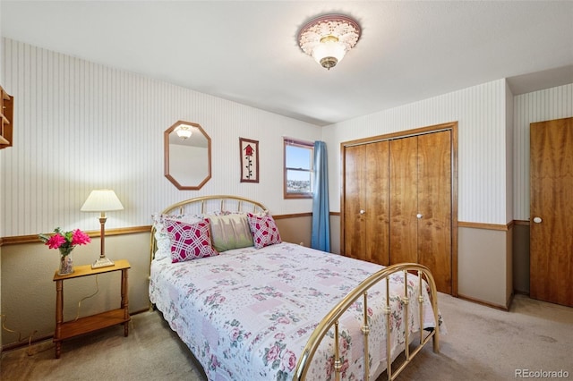 5245 Sapphire Dr, Colorado Springs, CO 80918 - bedroom featuring carpet floors, a closet, and wallpapered walls