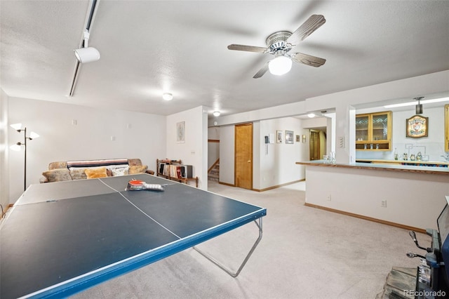 5245 Sapphire Dr, Colorado Springs, CO 80918 - game room featuring ceiling fan, light carpet, baseboards, and a textured ceiling