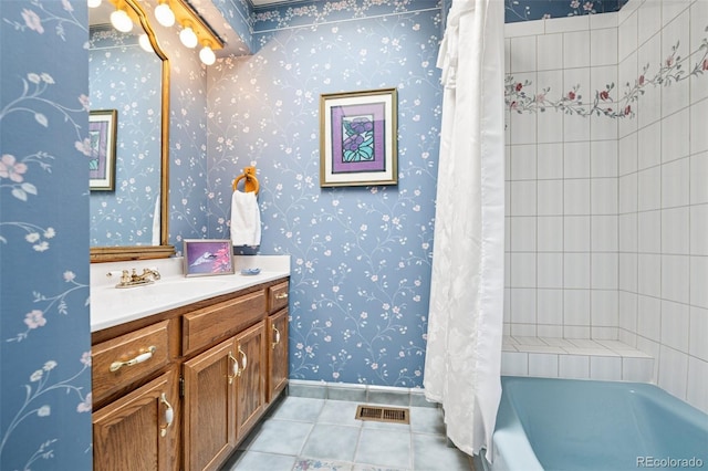 5245 Sapphire Dr, Colorado Springs, CO 80918 - bathroom featuring tile patterned flooring, vanity, wallpapered walls, baseboards, and shower / bathtub combination with curtain