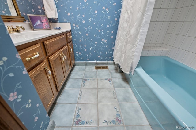 5245 Sapphire Dr, Colorado Springs, CO 80918 - full bathroom with wallpapered walls, baseboards, tile patterned floors, vanity, and shower / tub combo with curtain