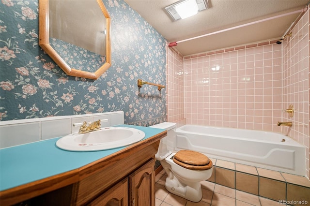 5245 Sapphire Dr, Colorado Springs, CO 80918 - full bathroom featuring shower / bath combination, toilet, tile patterned floors, wallpapered walls, and vanity
