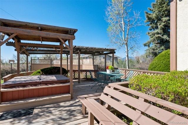 5245 Sapphire Dr, Colorado Springs, CO 80918 - deck featuring a covered hot tub, a pergola, and outdoor dining area