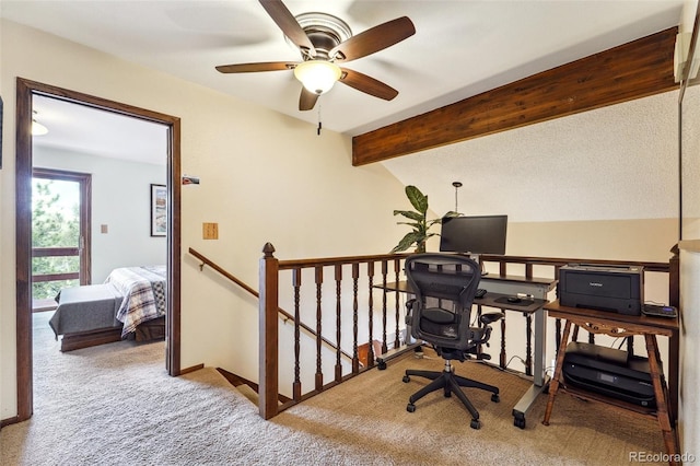 office area with lofted ceiling with beams, carpet, and baseboards