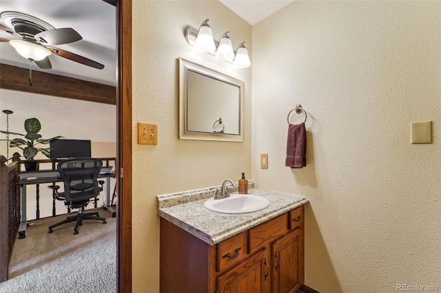 bathroom featuring ceiling fan and vanity