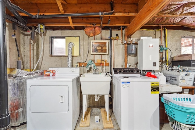 laundry area featuring laundry area, a sink, and washer and clothes dryer