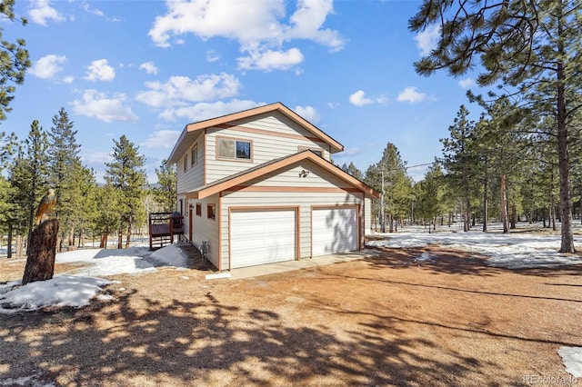 view of home's exterior featuring dirt driveway