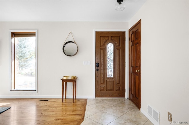 7551 S Garland St, Littleton, CO 80128 - entryway with healthy amount of natural light and light tile patterned floors