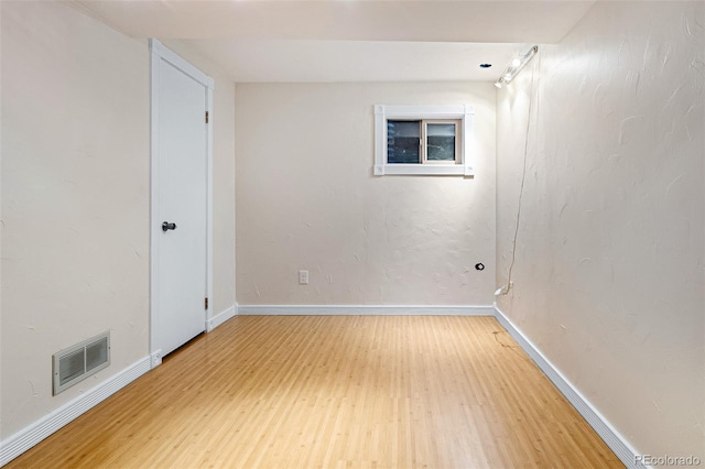 7551 S Garland St, Littleton, CO 80128 - unfurnished room with light wood-style floors and baseboards