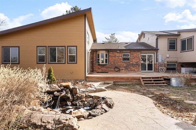 7551 S Garland St, Littleton, CO 80128 - rear view of property with a deck