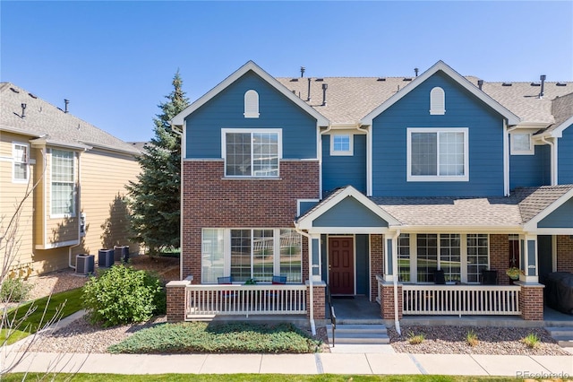 16179 E Geddes Ln Unit 96, Aurora, CO 80016 - view of front facade with a porch, brick siding, and a shingled roof