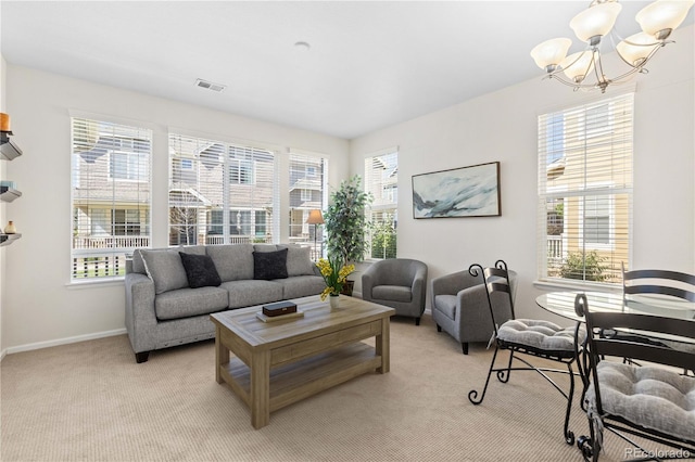 16179 E Geddes Ln Unit 96, Aurora, CO 80016 - living room featuring a chandelier, light colored carpet, and healthy amount of natural light