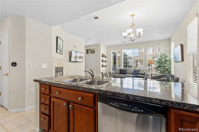 16179 E Geddes Ln Unit 96, Aurora, CO 80016 - kitchen featuring stainless steel dishwasher, tile counters, a chandelier, decorative light fixtures, and light tile patterned flooring