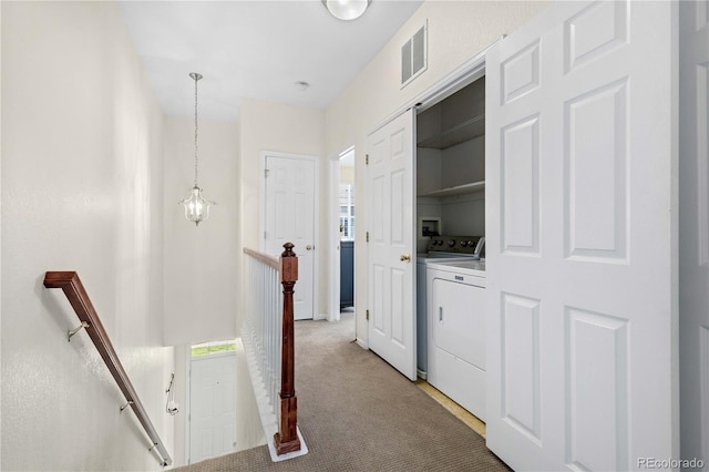 16179 E Geddes Ln Unit 96, Aurora, CO 80016 - corridor with an upstairs landing, light colored carpet, healthy amount of natural light, and washer and clothes dryer