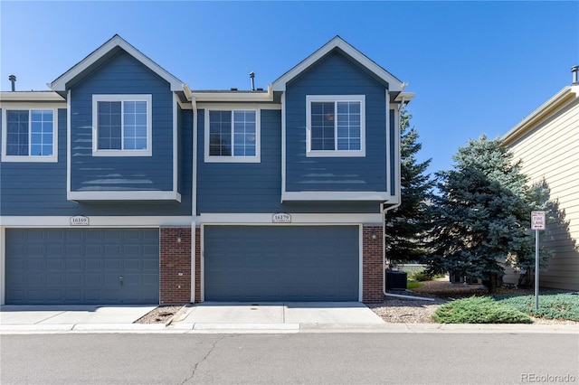 16179 E Geddes Ln Unit 96, Aurora, CO 80016 - view of front of property with a garage and brick siding