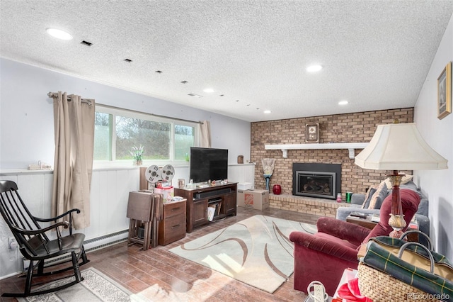 living room with recessed lighting, a baseboard radiator, a textured ceiling, and a fireplace