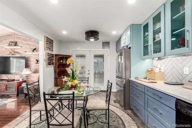 dining space featuring recessed lighting, french doors, and light wood-style floors