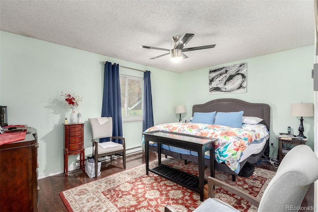 bedroom featuring a textured ceiling, ceiling fan, and wood finished floors