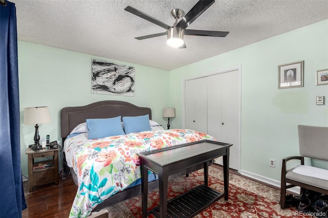 bedroom with baseboards, a textured ceiling, ceiling fan, and wood finished floors