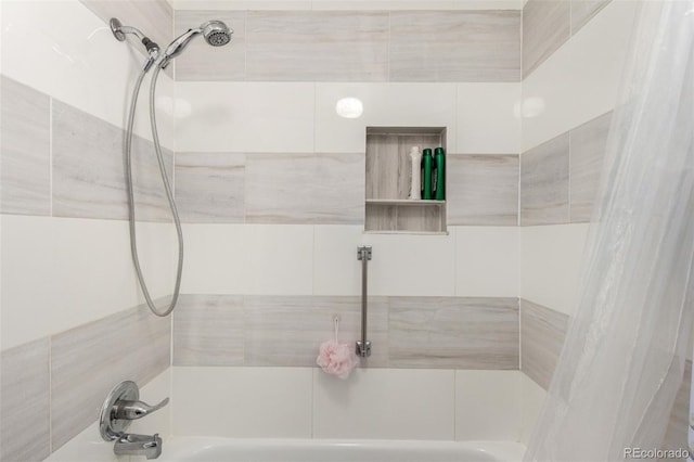 bathroom with shower / bath combination with curtain