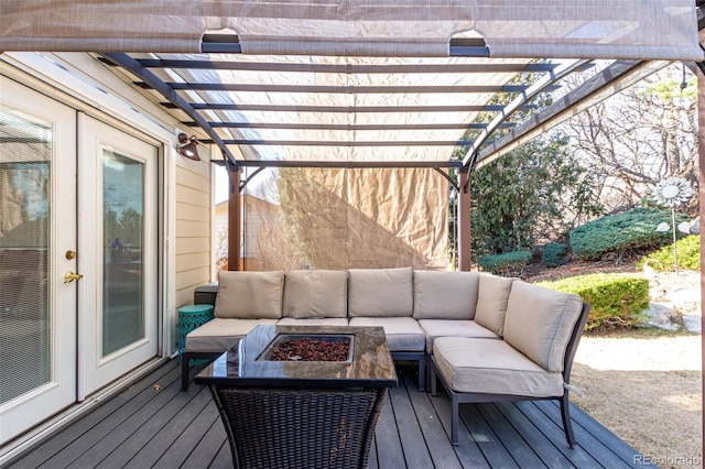 deck with french doors, an outdoor living space with a fire pit, and a pergola