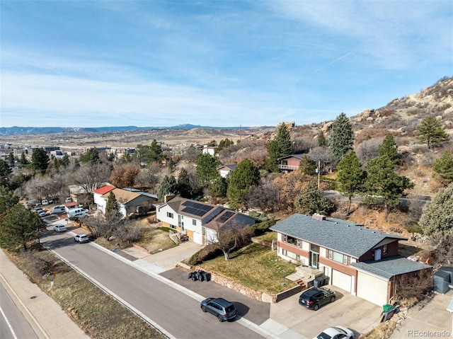 aerial view featuring a mountain view and a residential view