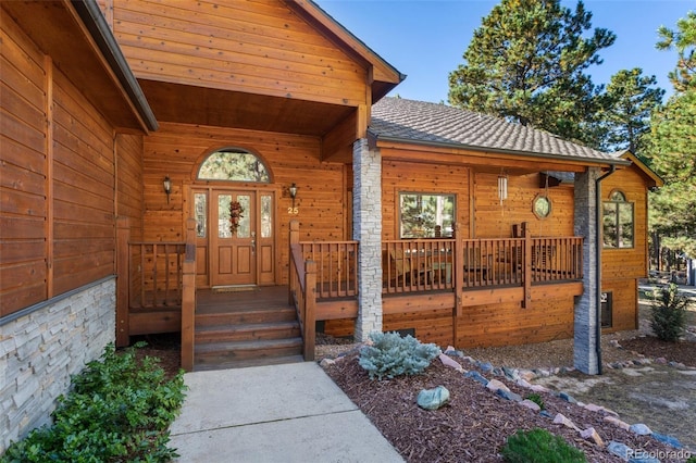 doorway to property featuring covered porch