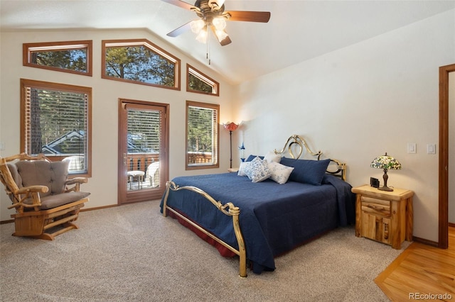 carpeted bedroom featuring lofted ceiling and ceiling fan