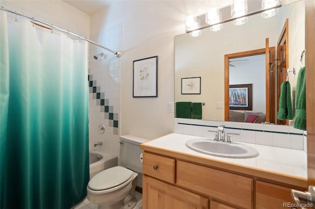 full bathroom with vanity, shower / bath combination with curtain, and toilet