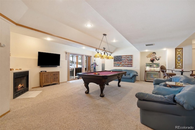 playroom with lofted ceiling, light colored carpet, a tile fireplace, and billiards