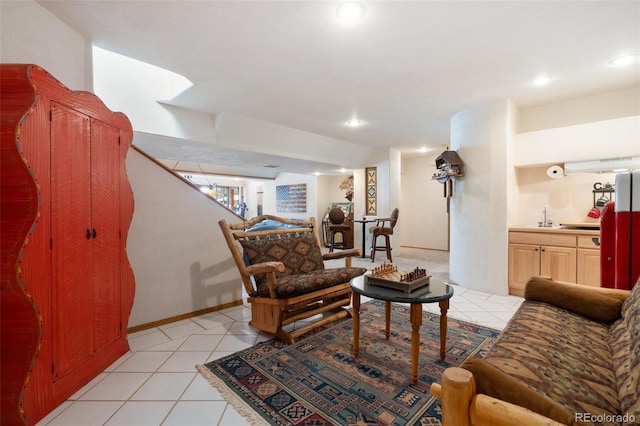 living room with sink and light tile patterned floors