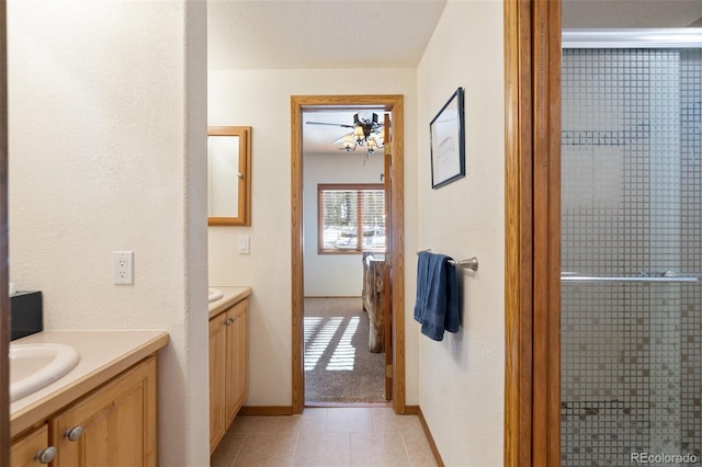 bathroom with tile patterned floors and vanity