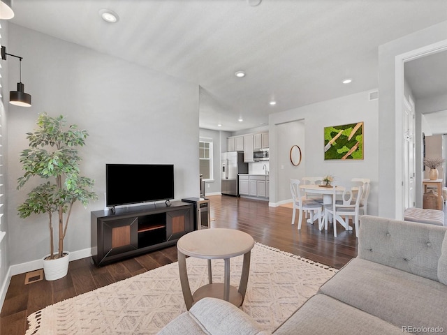 14565 Vancouver Pl, Parker, CO 80134 - living area featuring dark wood-type flooring and recessed lighting