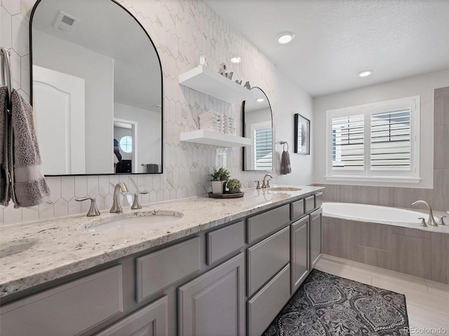 14565 Vancouver Pl, Parker, CO 80134 - full bath with double vanity, a garden tub, and backsplash