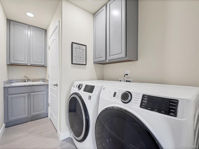 14565 Vancouver Pl, Parker, CO 80134 - washroom with washing machine and clothes dryer, cabinet space, and recessed lighting