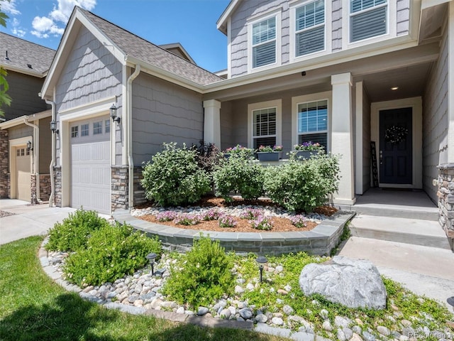 14565 Vancouver Pl, Parker, CO 80134 - view of front facade featuring an attached garage, roof with shingles, driveway, and stone siding