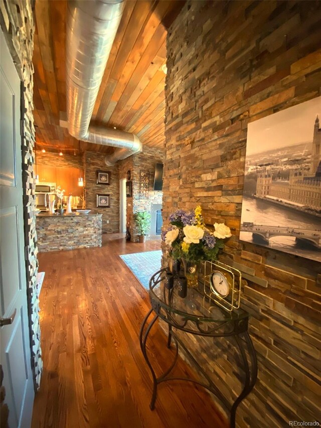 10111 Inverness Main St Unit 223, Englewood, CO 80112 - hallway featuring wood finished floors and wooden ceiling