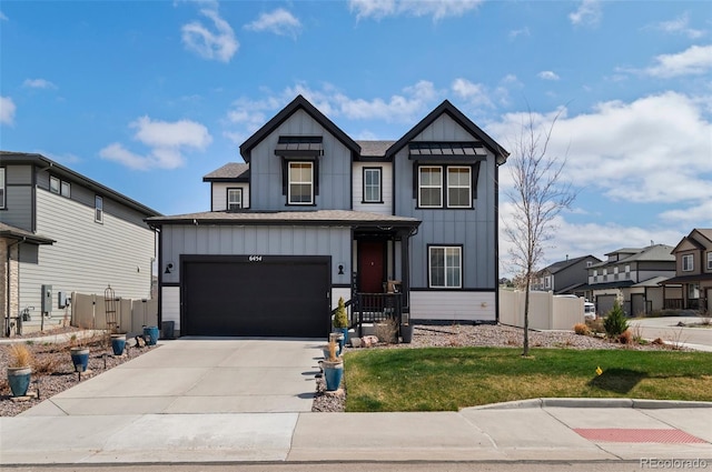 6454 Leathers Ln, Parker, CO 80134 - view of front of property with board and batten siding, concrete driveway, and a shingled roof