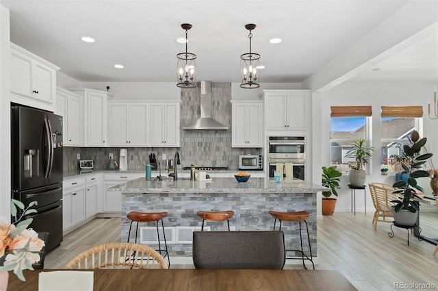 6454 Leathers Ln, Parker, CO 80134 - kitchen featuring fridge with ice dispenser, wall chimney range hood, stainless steel double oven, decorative backsplash, and recessed lighting