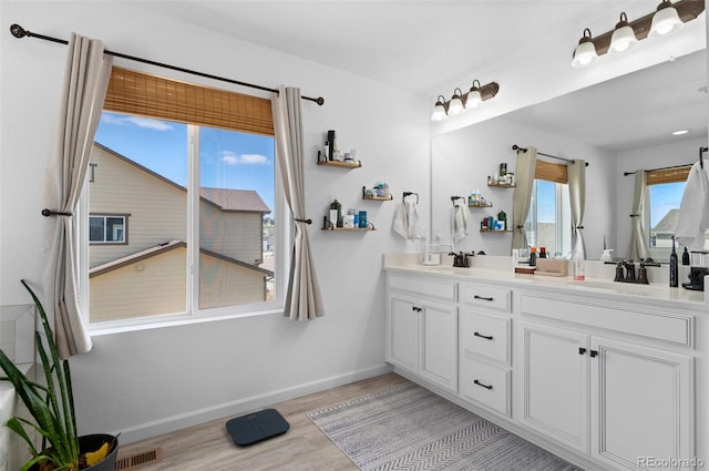 6454 Leathers Ln, Parker, CO 80134 - full bath with double vanity and wood finished floors