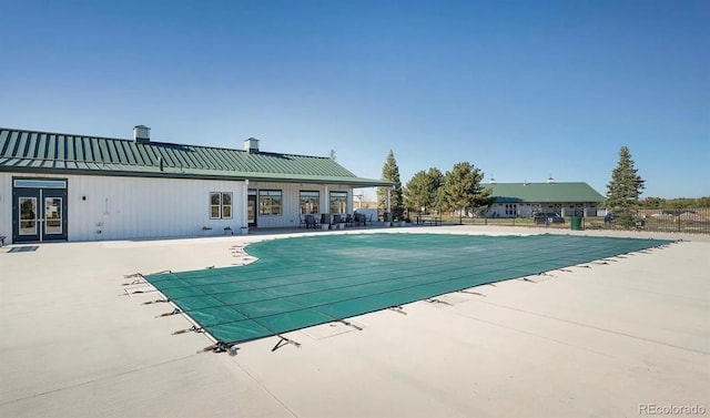 6454 Leathers Ln, Parker, CO 80134 - community pool featuring a patio and french doors