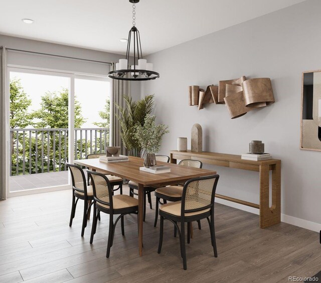 dining space featuring a chandelier, wood finished floors, recessed lighting, and baseboards