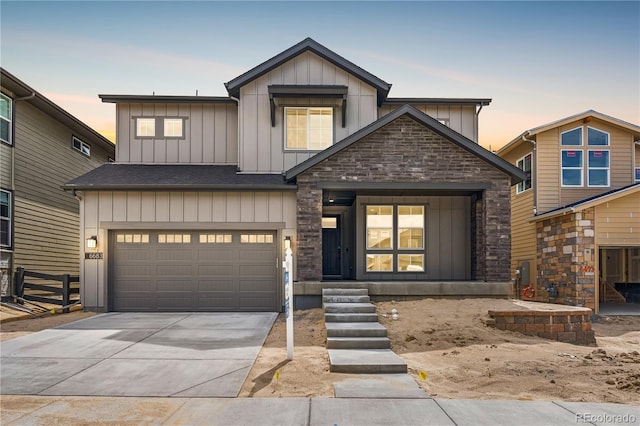 6683 Bridle Creek Pt, Castle Pines, CO 80108 - view of front of home featuring board and batten siding, driveway, an attached garage, and stone siding