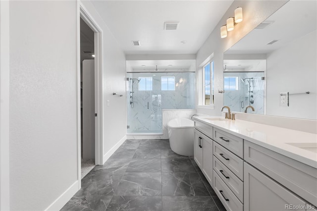 6683 Bridle Creek Pt, Castle Pines, CO 80108 - bathroom with marble look tiles, a marble finish shower, double vanity, and a freestanding tub